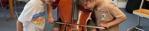 Kinder am Cello